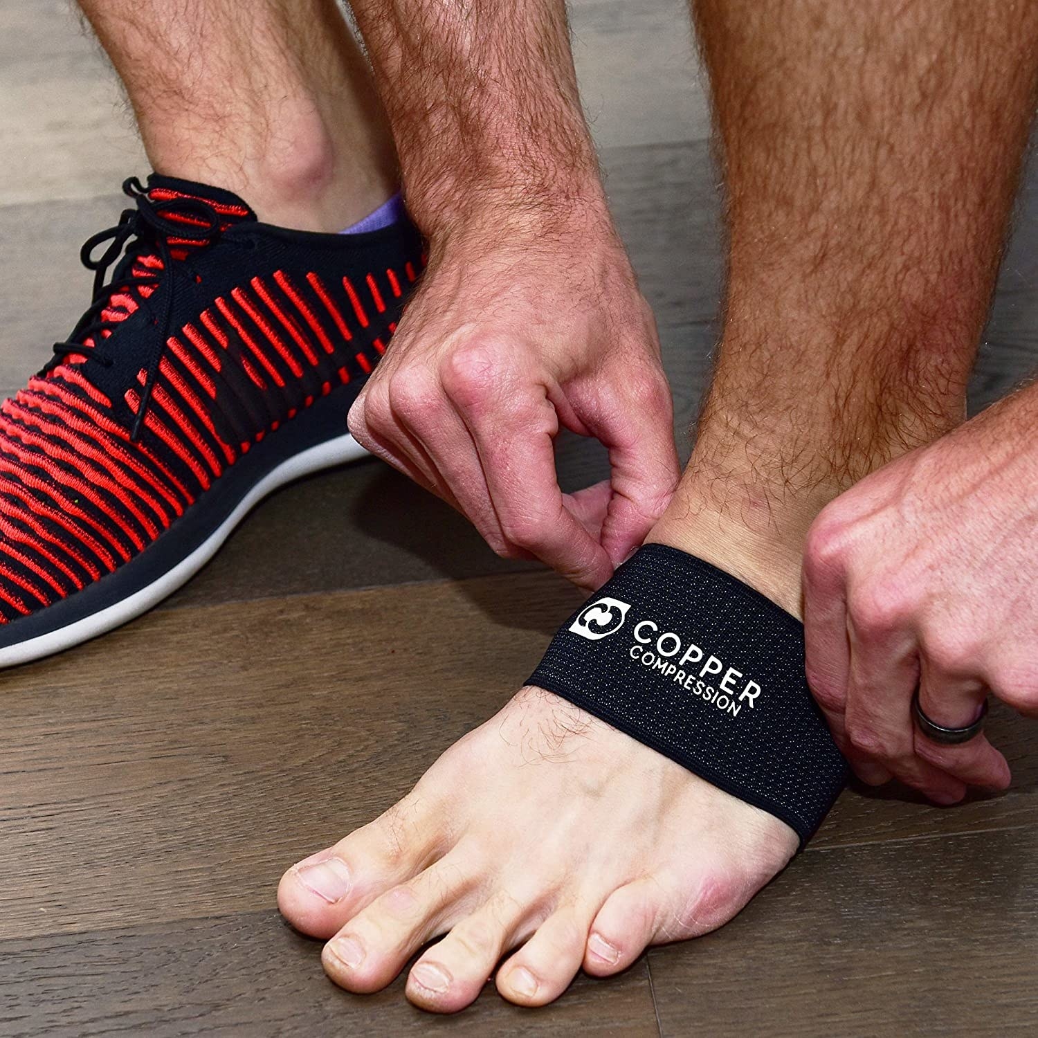 A runner wearing the supports on their foot arches