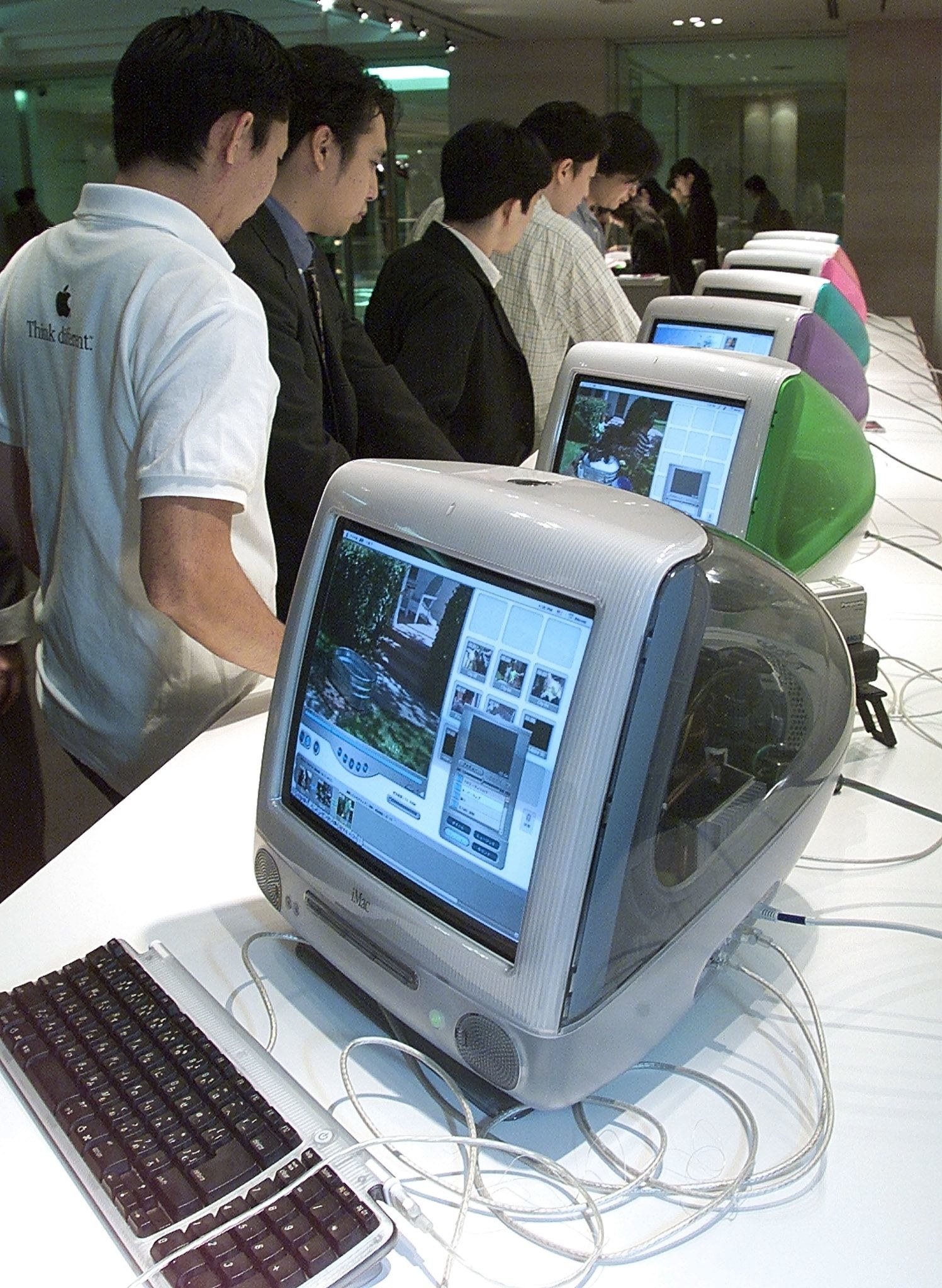 People look at the new MacIntosh computers in Japan in 1999