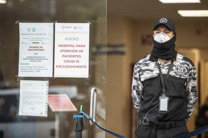 A man stands guard outside the covid ward of a hospital in Mexico City