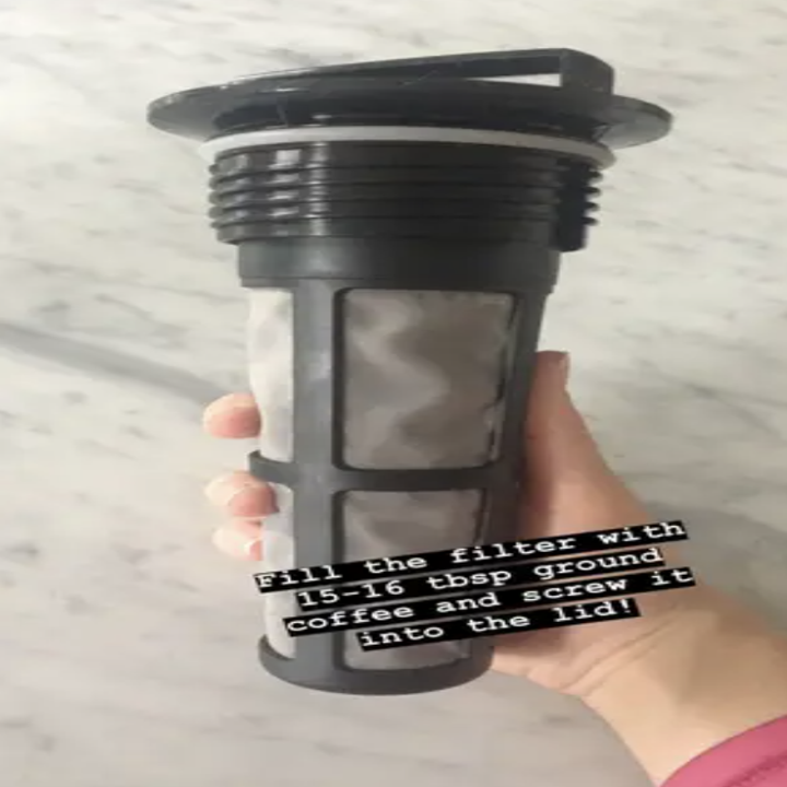 Reviewer holding coffee filter