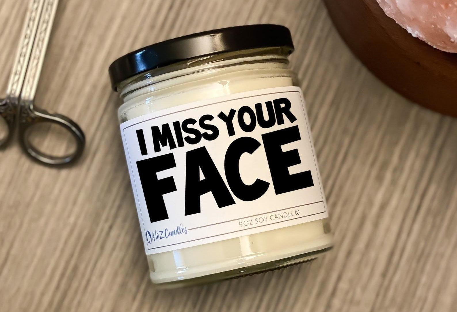 the candle with a label that reads &quot;I miss your face&quot;