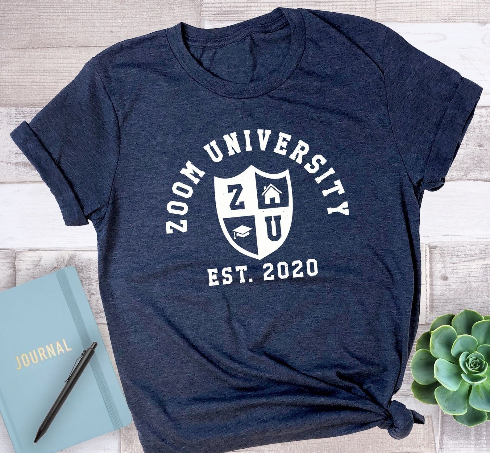 The shirt in blue that reads &quot;Zoom University est 2020&quot;