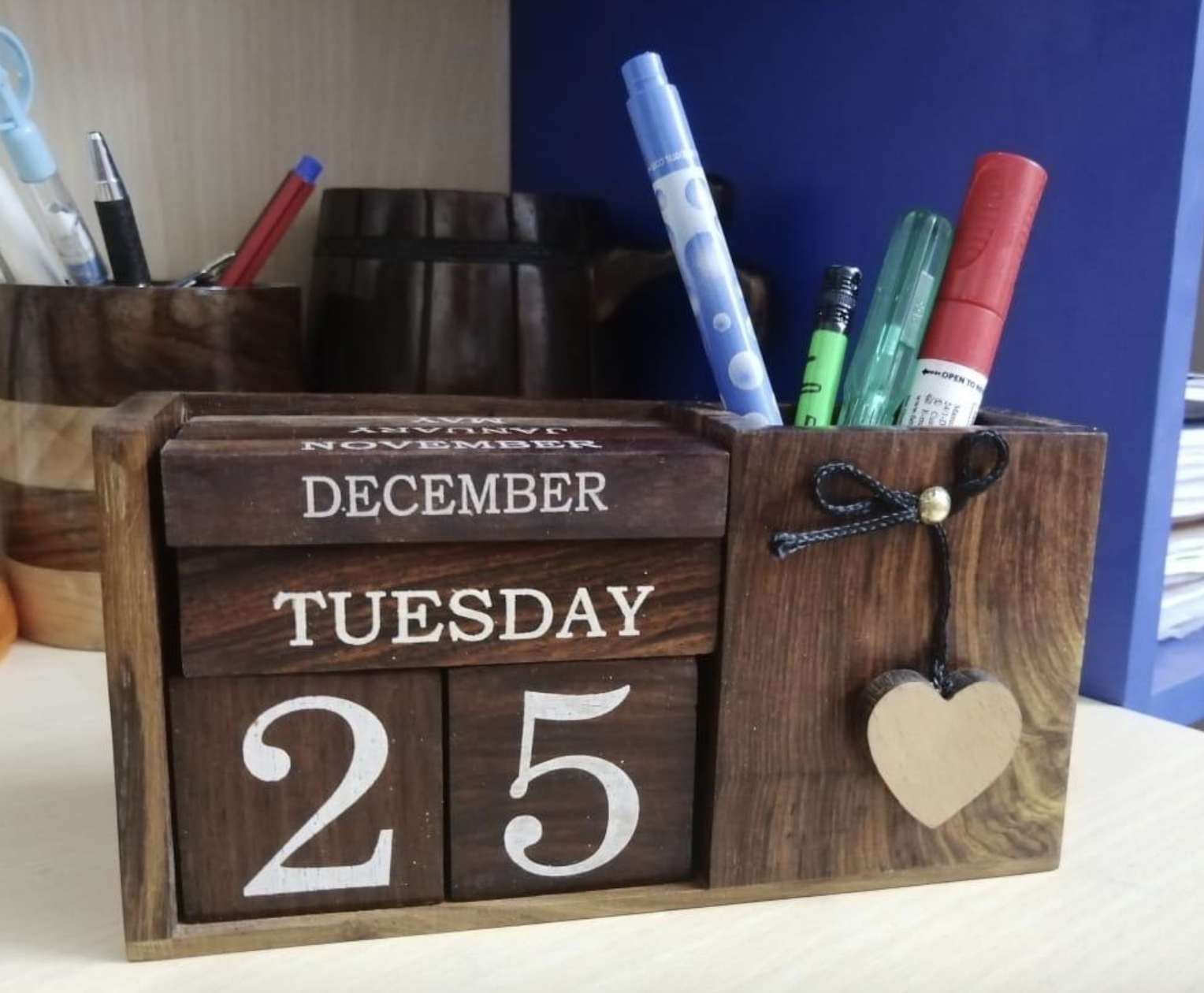 reviewer photo of the wooden desk calendar
