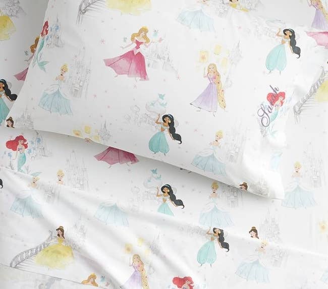 disney princess sheets with belle, jasmine, ariel, aurora, cinderella, and rapunzel on them