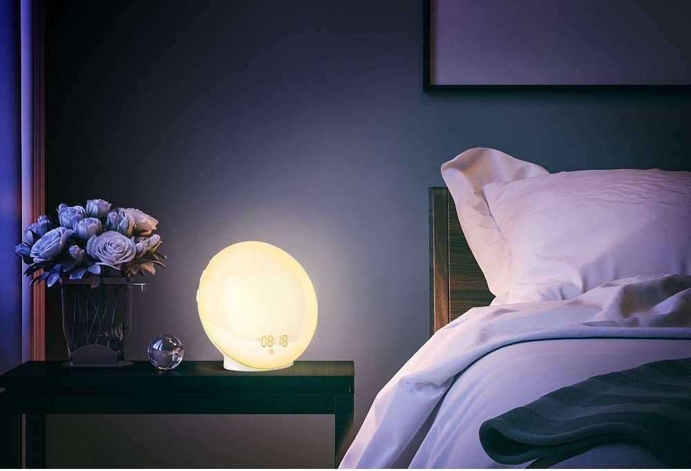 light alarm clock on a bedside table 