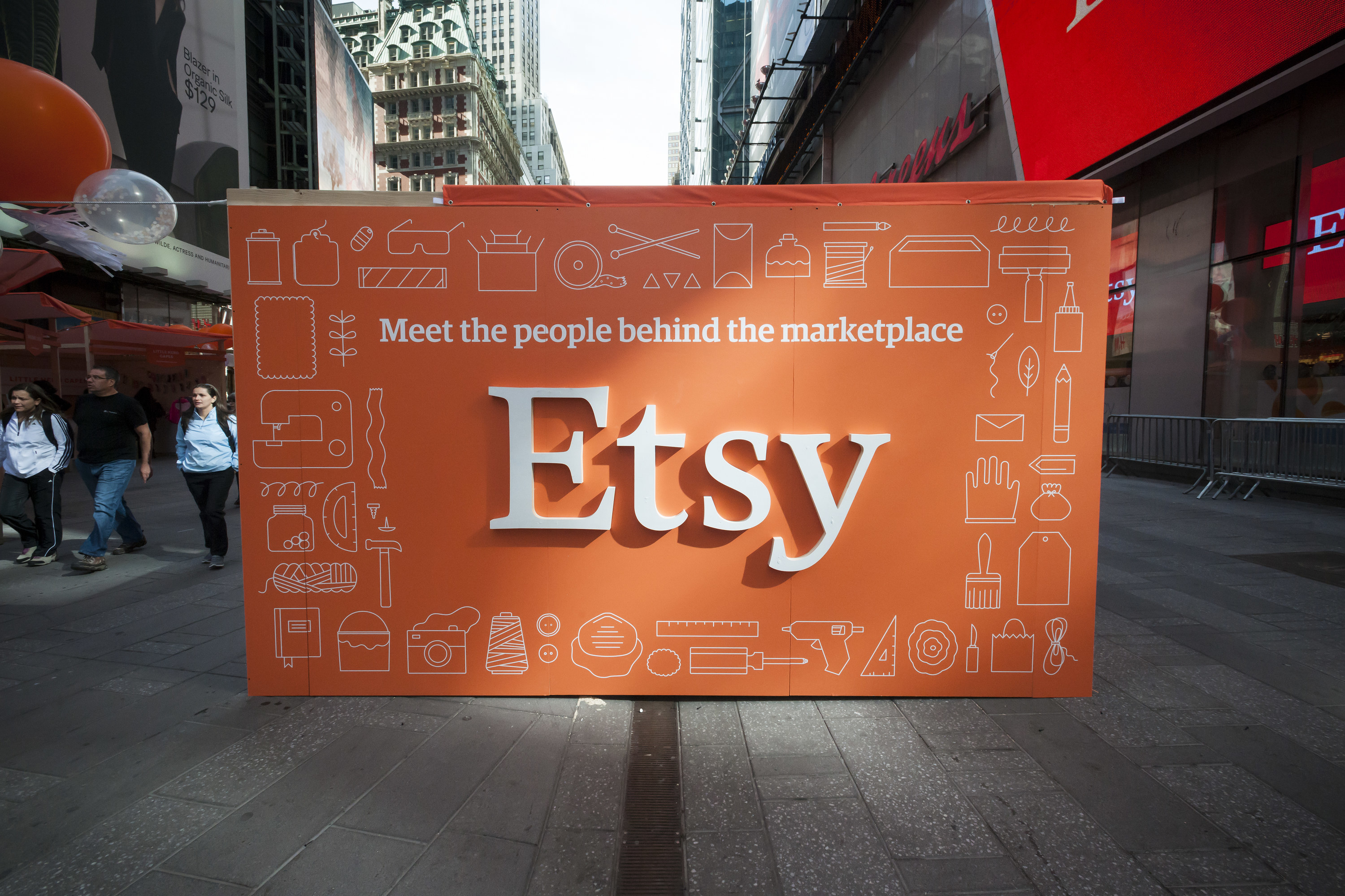 An Etsy sign in New York City&#x27;s Times Square reads &quot;Meet the people behind the marketplace&quot;