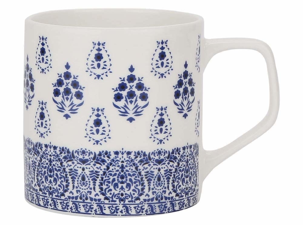 A white mug with blue block print design