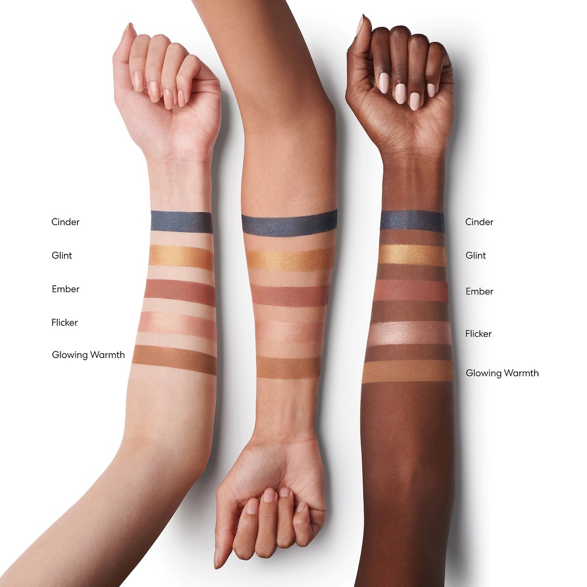 Models with different skin tones showing off all of the bronzer and eyeshadow palette shades on their forearms