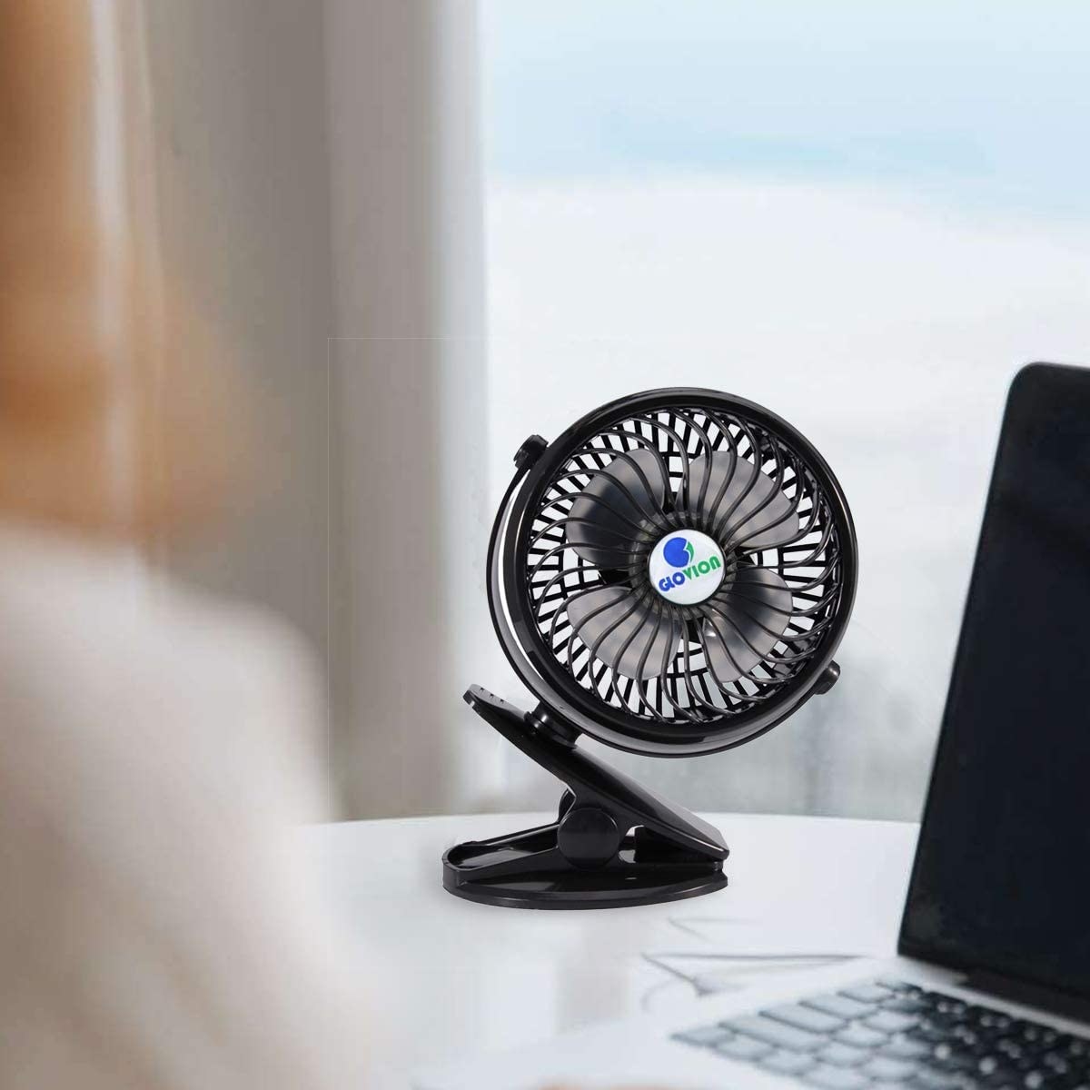 A small black desk fan