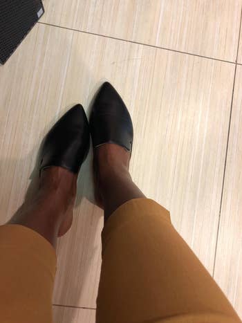 Reviewer wearing the mules in black