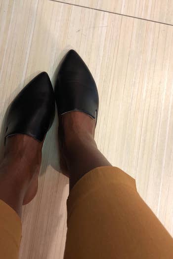 Reviewer wearing the mules in black
