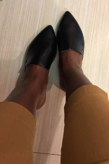 Reviewer wearing the mules successful black