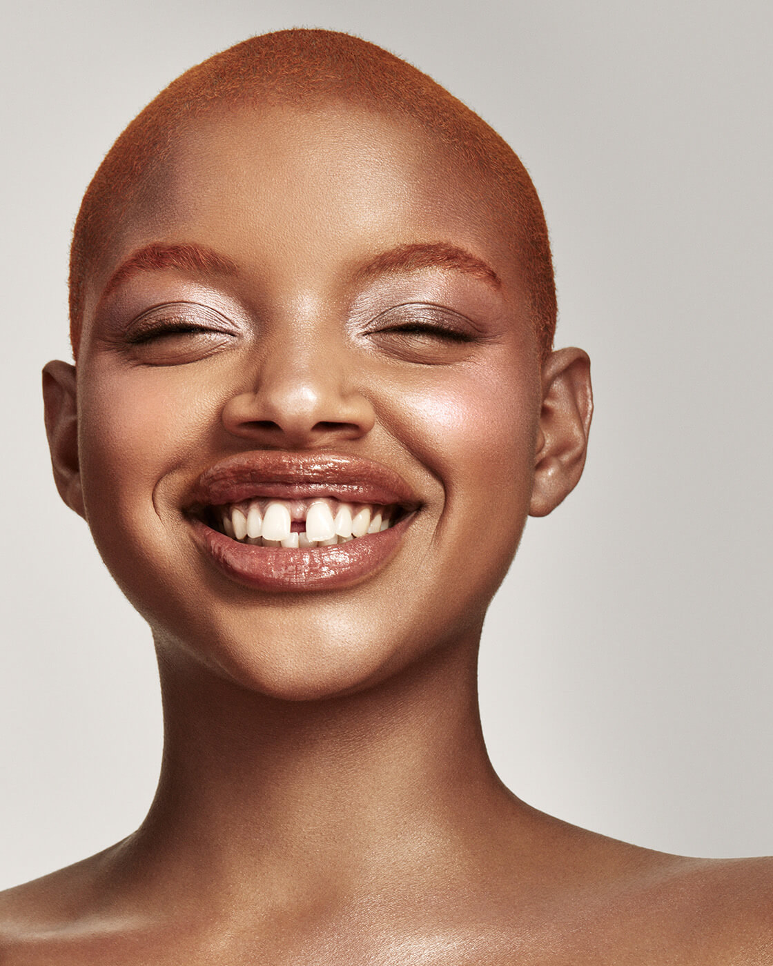 a Black model with the killawatt freestyle highlighter duo in LIGHTNING DUST / FIRE CRYSTAL on their face