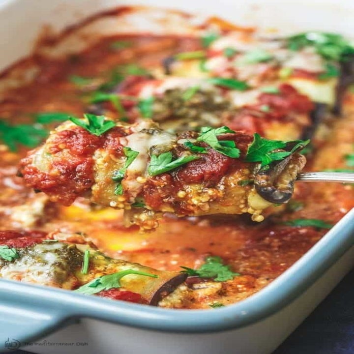 Cheesy baked eggplant rollatini in tomato sauce.