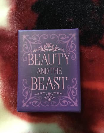 A tiny purple beauty and the beast book 