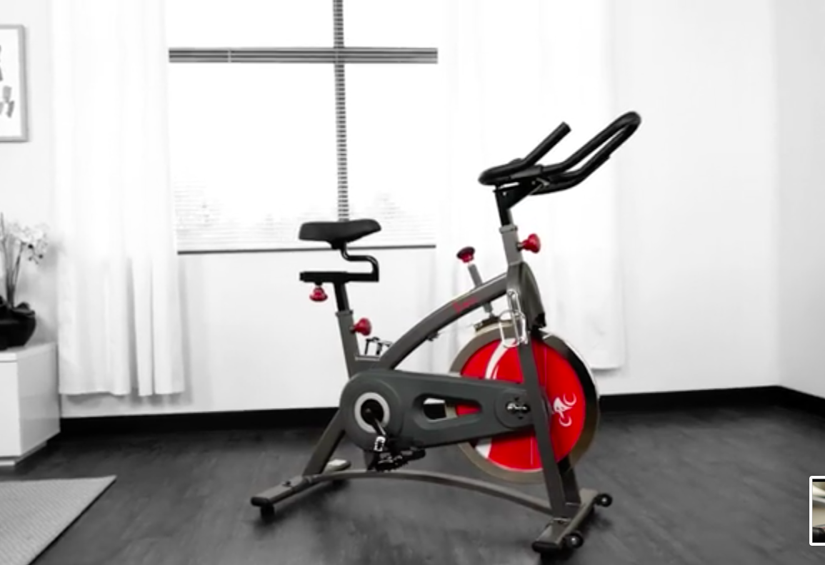 The indoor cycling bike in a bright room beside a big window