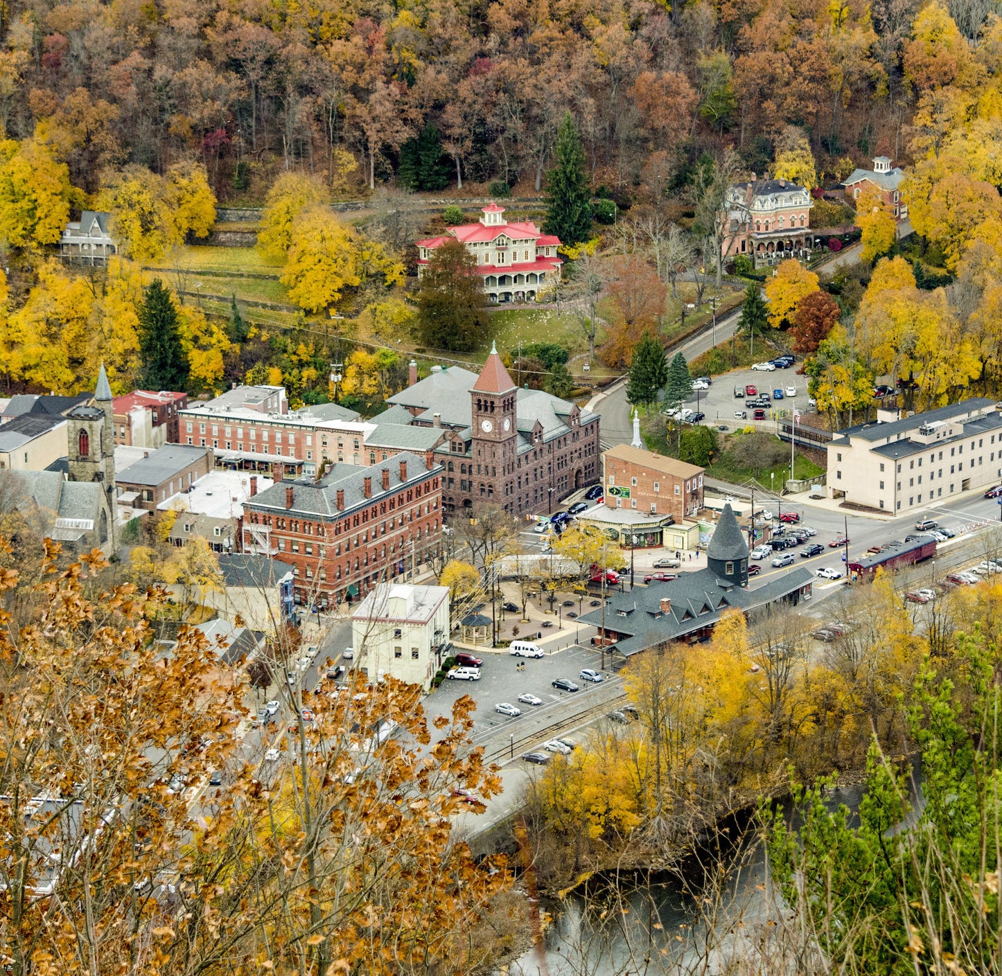 historic buildings and a townhall surrounded by fall foliage 