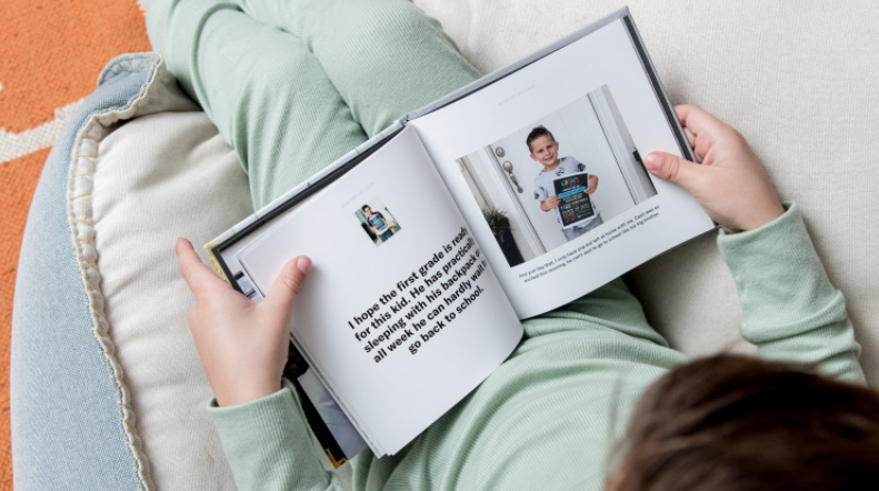 a kid looking through a chatbook 