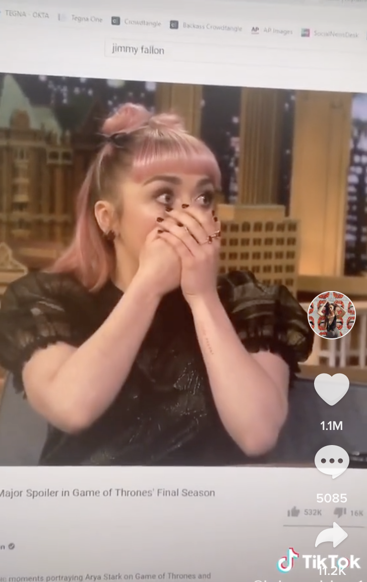 Screenshot of Maisie Williams with her hands over her face.