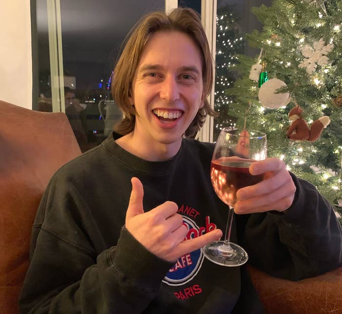 Stephen smiles with a glass of rosé