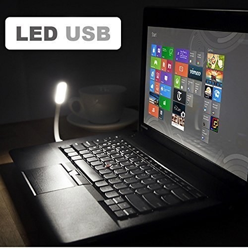 A USB lamp attached to a laptop and lighting up its keyboard