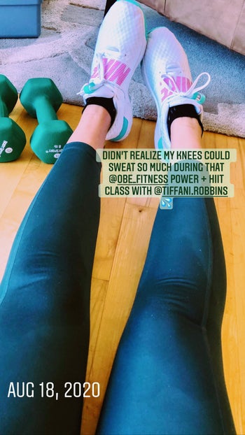 Abby Kass showing the sweat through her leggings with 10 pound weights right next to her