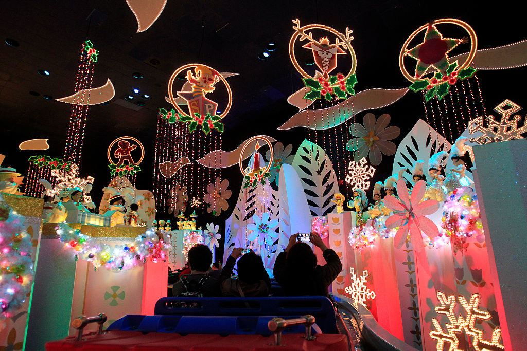 Disneyland visitors cruise through &quot;It&#x27;s a Small World&quot; featuring different Christmas and holiday celebrations from around the world