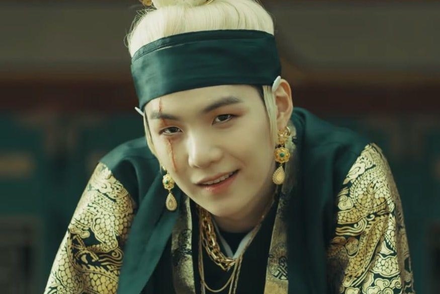 Agust D smirks in the &quot;Daechwita&quot; music video