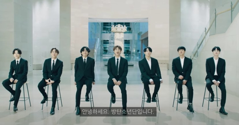 BTS wear suits and sit on stools