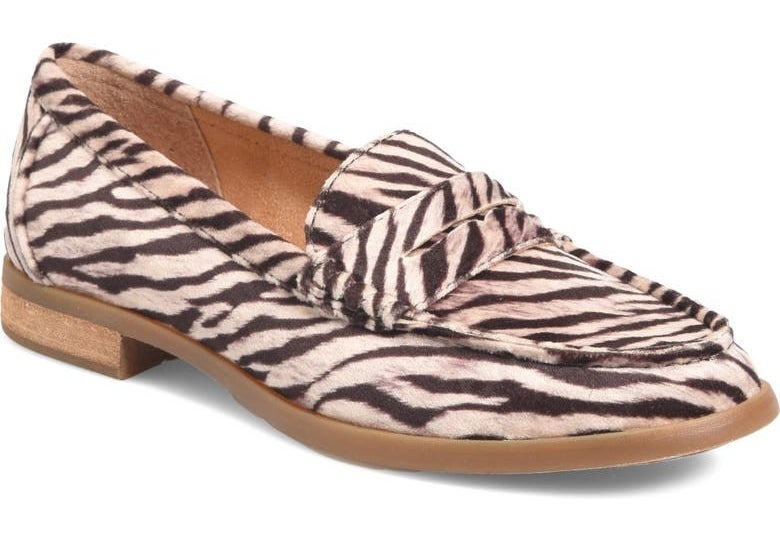 The white and black giraffe-print loafers
