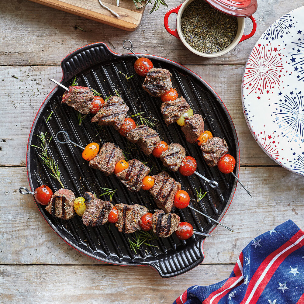 Le Creuset bistro grill with kabobs on it 