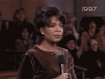 Gif of Oprah jumping up with excitement