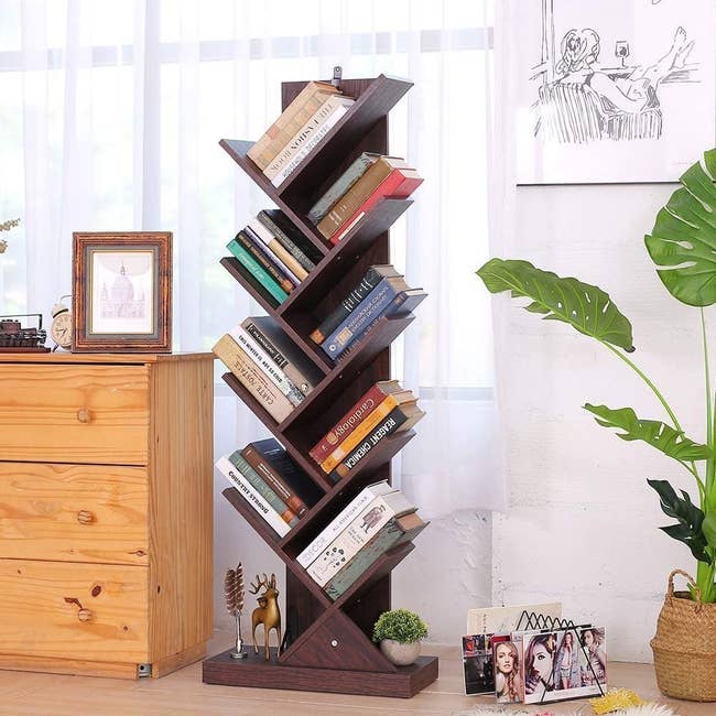 a walnut colored shelf with slanted shelves throughout