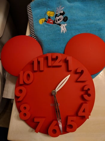 a reviewer's photo of the clock in red