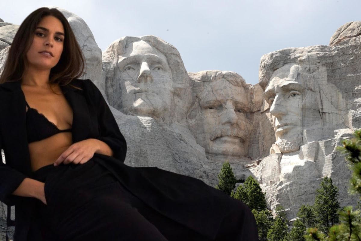 A photoshopped image of Cali in a bralette shows her in front of Mount Rushmore