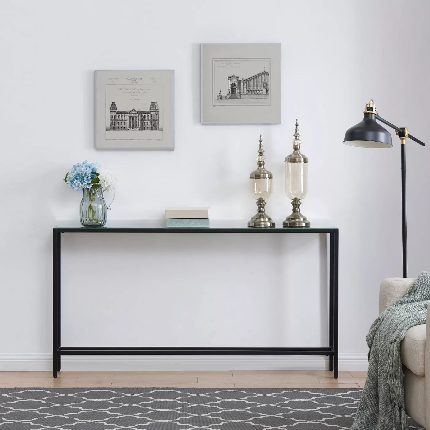 The console table with a black frame and glass top