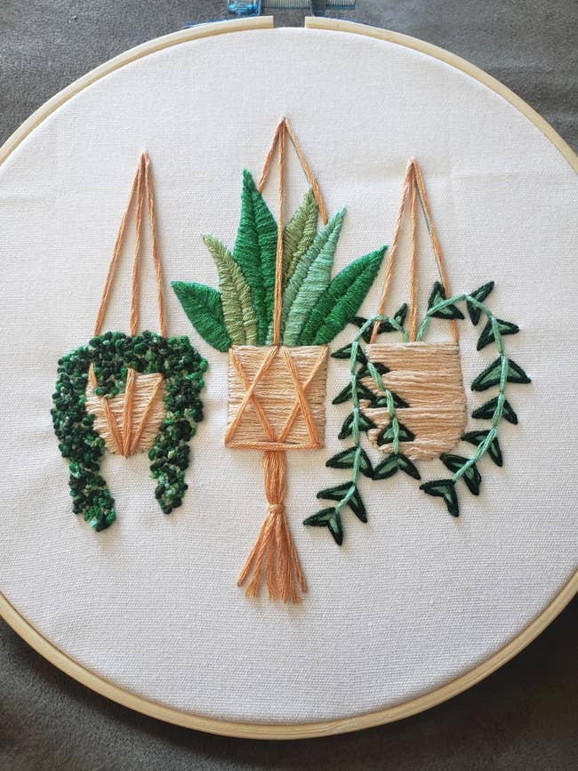 three embroidered plants in a hoop
