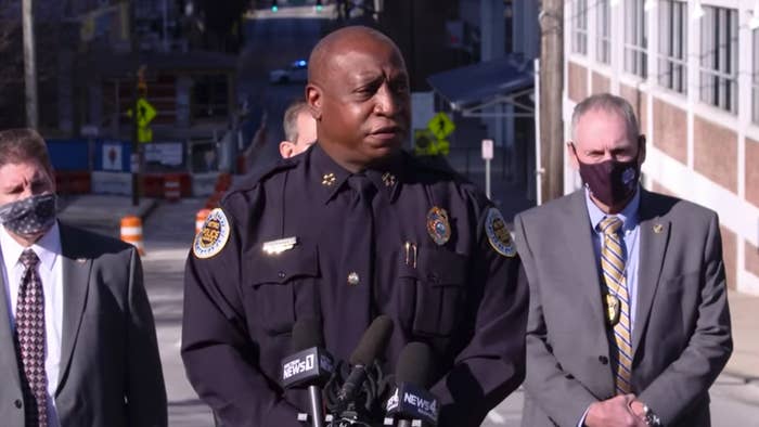 A police chief speaks in front of cameras