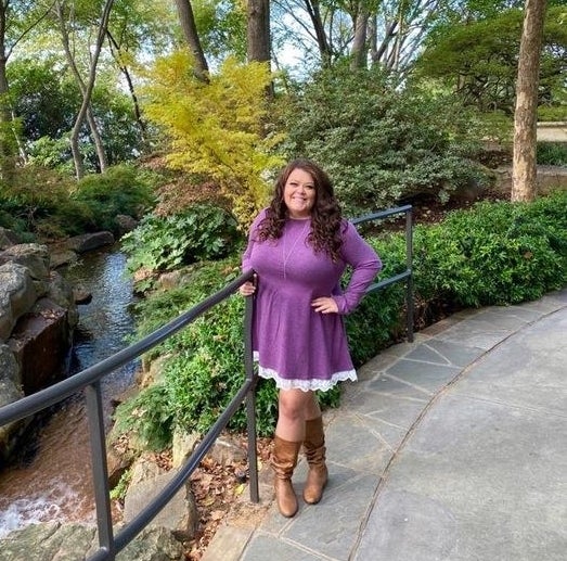 Reviewer wearing the lace-trim long-sleeve dress in purple