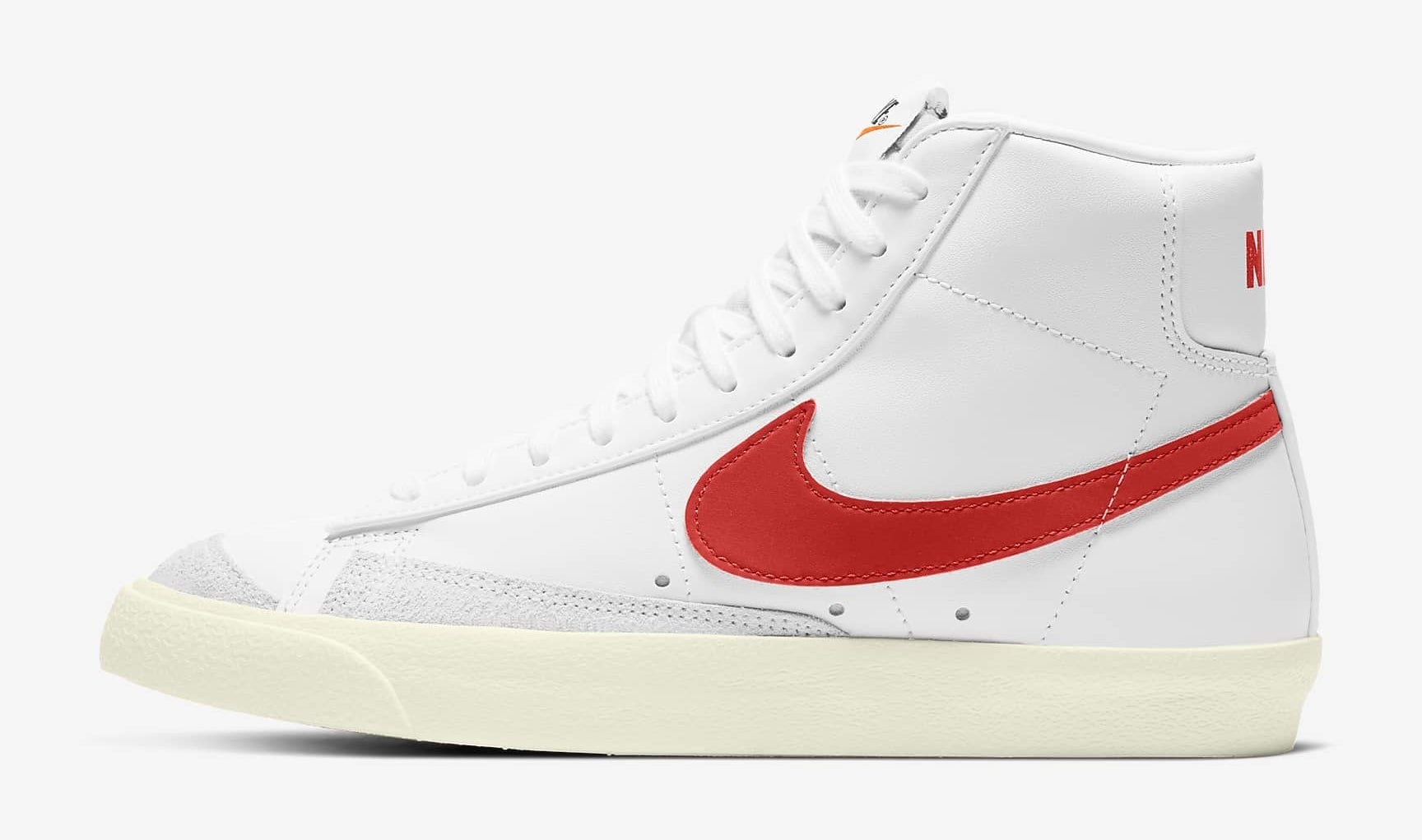 the white sneakers with a red check