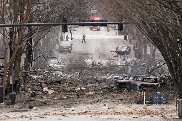 Emergency personnel work near the scene of an explosion