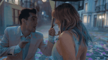 a gif of brendon urie and taylor swift in the me music video