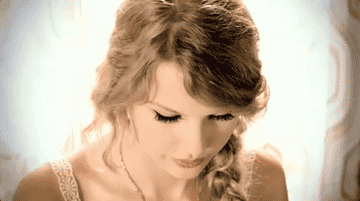 a gif of taylor swift in the mine music video