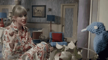 a gif of taylor swift in the we are never ever getting back together music video