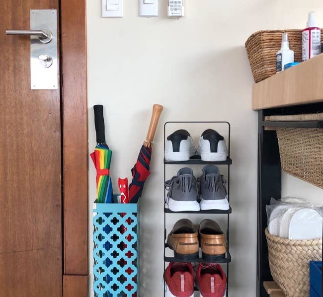 reviewer photo showing shoe rack in their entryway 
