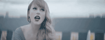 a gif of taylor swift in the begin again music video