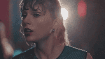 a gif of taylor swift in the delicate music video