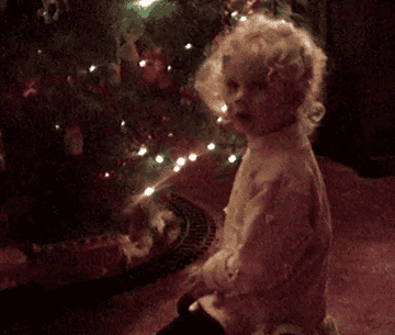 a gif of young taylor swift from the christmas tree farm music video