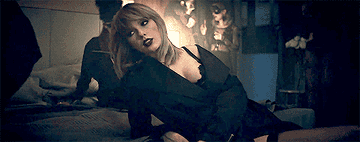 a gif of taylor swift in the &quot;I don&#x27;t wanna live forever&quot; music video