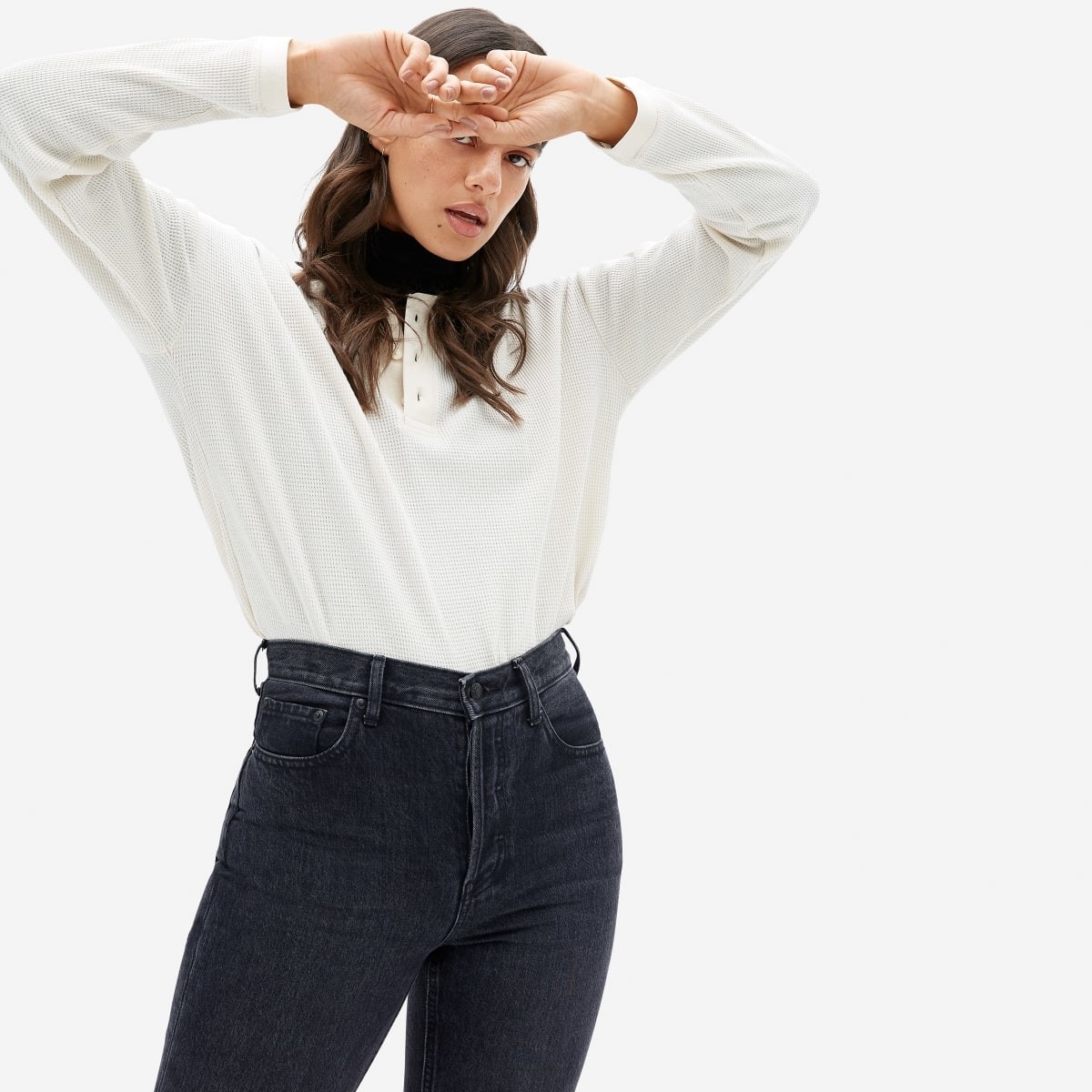 model wears long sleeve white shirt with three button collar 